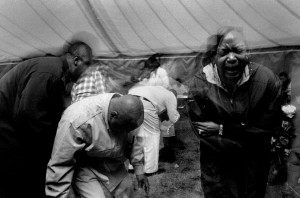 Worshippers are overcome by their religion during a christian tent revival in Great Falls, Montana.